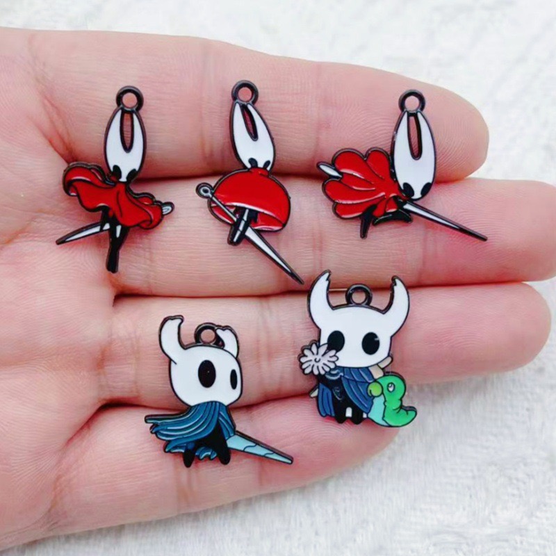 Party Games Crazy - 10 pendentifs en alliage motif dessin