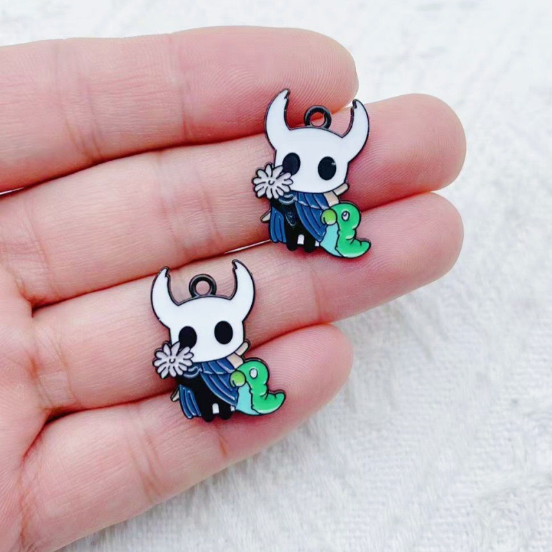 10 pendentifs en alliage motif - Party Games Crazy avis et prix